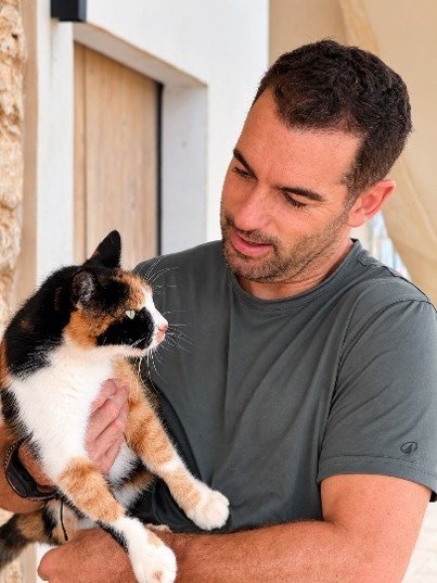 Carlos caring for a cat at a Mallorca property